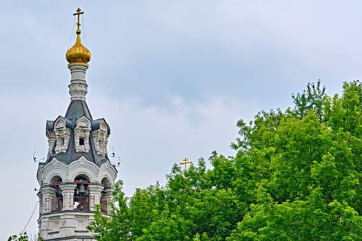 Russia-2020. Church domes of the Orthodox Church behind the trees. general plan. daylight