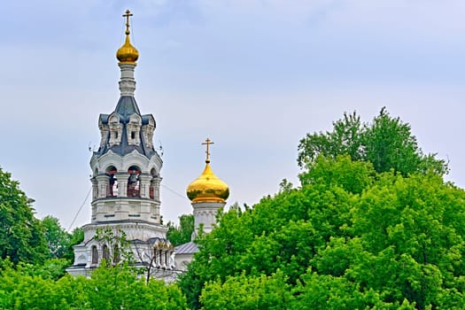 Russia-2020. Church domes of the Orthodox Church behind the trees. general plan. daylight