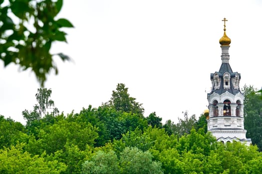 Russia-2020. Church domes of the Orthodox Church behind the trees. general plan. daylight