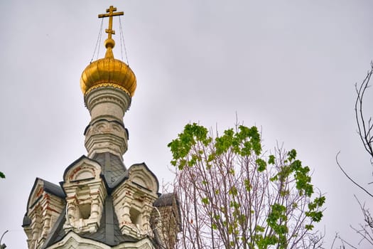 Russia-2020. Church domes of the Orthodox Church behind the trees. general plan. daylight