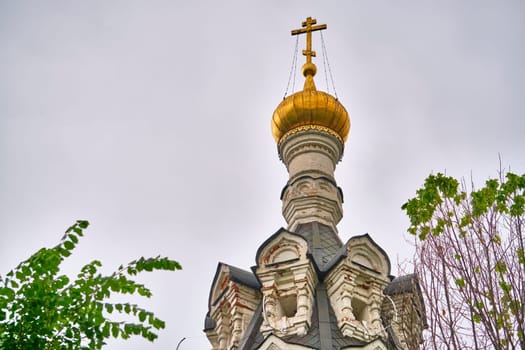 Russia-2020. Church domes of the Orthodox Church behind the trees. general plan. daylight