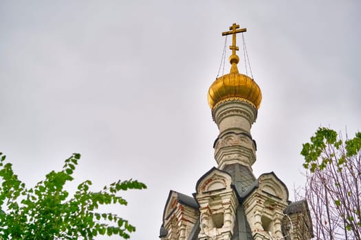 Russia-2020. Church domes of the Orthodox Church behind the trees. general plan. daylight