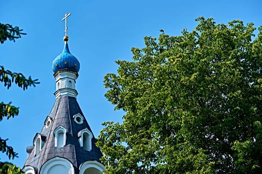 Russia-2020. Church domes of the Orthodox Church behind the trees. general plan. daylight