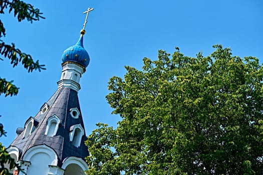 Russia-2020. Church domes of the Orthodox Church behind the trees. general plan. daylight