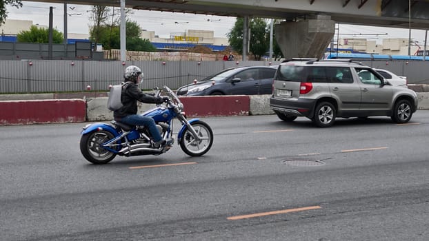 moscow russia 2020. a motorcyclist rides in traffic.