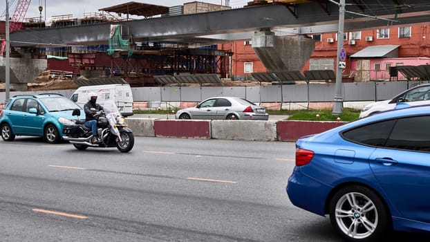 moscow russia 2020. a motorcyclist rides in traffic.