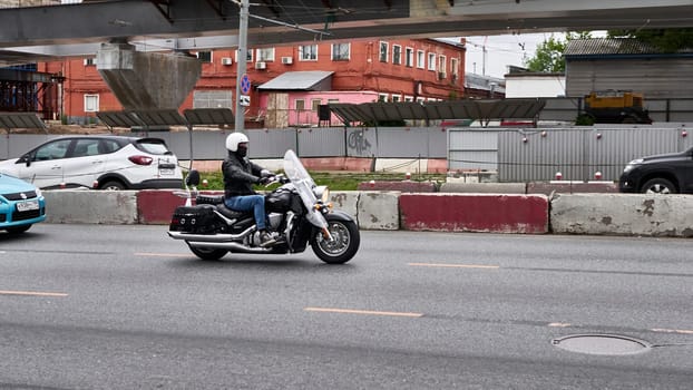 moscow russia 2020. a motorcyclist rides in traffic.