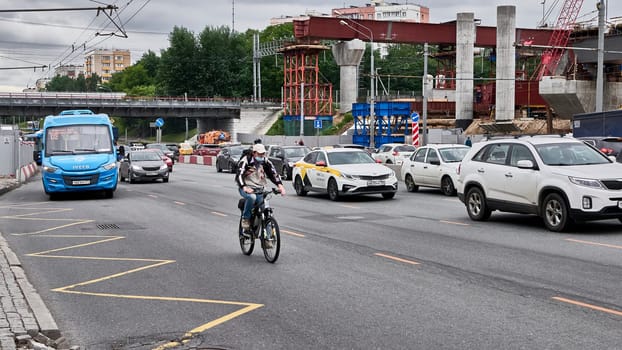 moscow russia 2020. a motorcyclist rides in traffic.