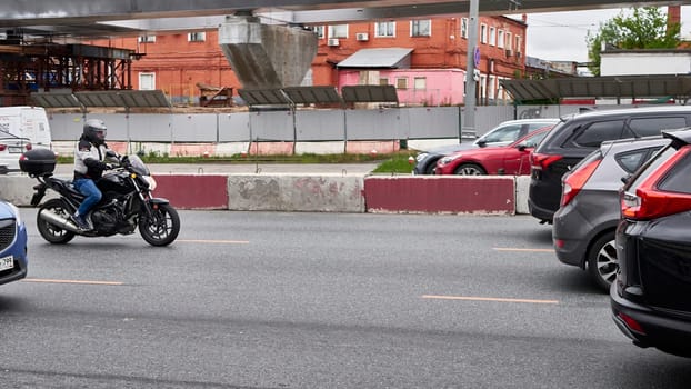 moscow russia 2020. a motorcyclist rides in traffic.