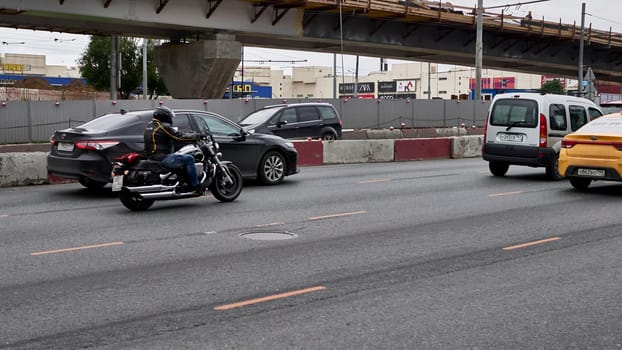 moscow russia 2020. a motorcyclist rides in traffic.