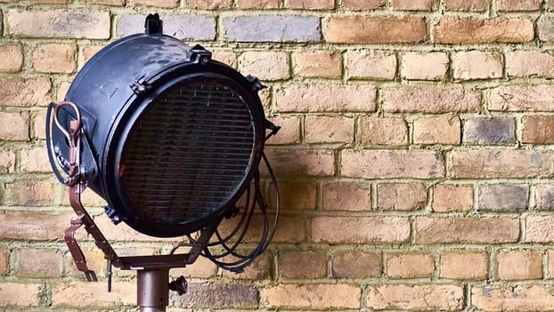 studio lamp against the background of a brick wall