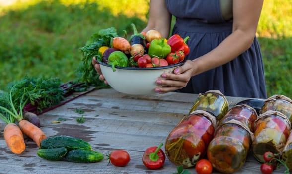 woman in the garden with vegetables in her hands.