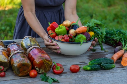 woman in the garden with vegetables in her hands.