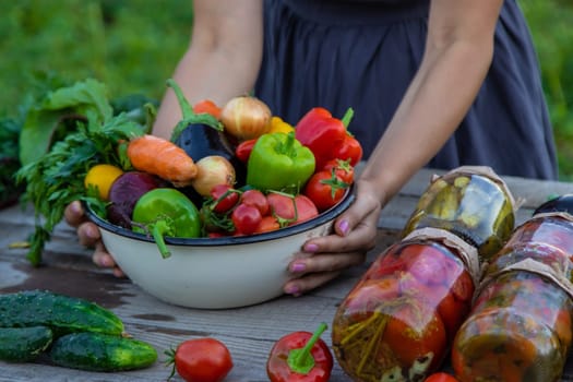 woman in the garden with vegetables in her hands.