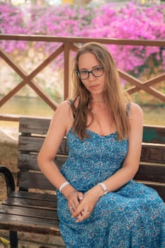 Woman sits on the bench in Alanya city, Turkey. Travelling or vacation concept