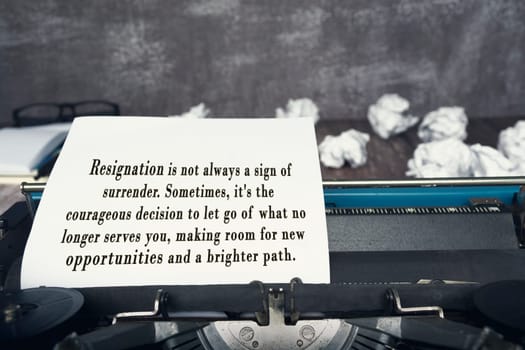 Motivational and inspirational quote on an old typewriter with trash paper background.