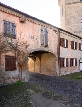 Mesola, Italy. February 25, 2024.  The buildings around the courtyard  of the ancient Mesola Castle in the town center