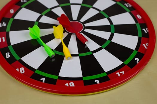 Dartboard made of magnetic material with safe darts for children, game of throwing projectile at target