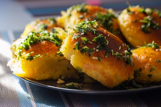 Close-up of garlic bread with parsley. Food photography for recipe and menu design.