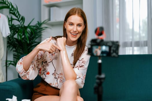 Woman influencer shoot live streaming vlog video review makeup utmost social media or blog. Happy young girl with cosmetics studio lighting for marketing recording session broadcasting online.