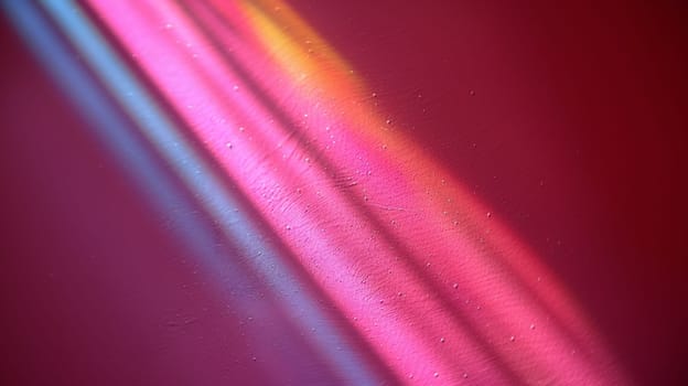 A close up of a rainbow colored object with some light coming from it