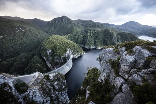 View of the Gordon Dam on a cool summer's day. It is a unique double curvature concrete arch dam with a spillway across the Gordon River near Strathgordon, South West Tasmania, Australia