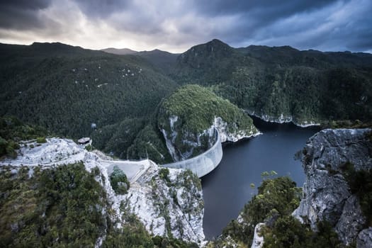 View of the Gordon Dam on a cool summer's day. It is a unique double curvature concrete arch dam with a spillway across the Gordon River near Strathgordon, South West Tasmania, Australia