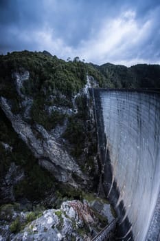 View of the Gordon Dam on a cool summer's day. It is a unique double curvature concrete arch dam with a spillway across the Gordon River near Strathgordon, South West Tasmania, Australia