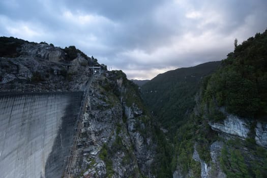 View of the Gordon Dam on a cool summer's day. It is a unique double curvature concrete arch dam with a spillway across the Gordon River near Strathgordon, South West Tasmania, Australia