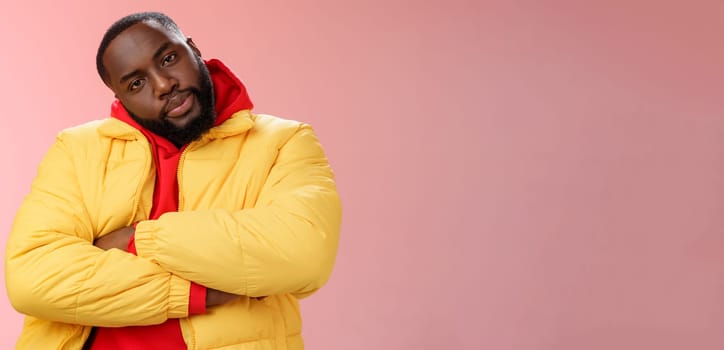 Show me whatcha got. Portrait cool stylish serious-looking urban black bearded guy in trendy yellow hoodie cross arms over chest tilting head wanna see what prepared rival standing confident.