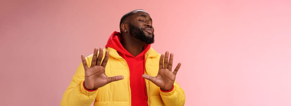 Relax I deal it. Unbothered chill good-looking confident bossy african bearded guy smiling asking enough stop apologizing raise palms calm down gesture grinning blushing heartwarming greeting.
