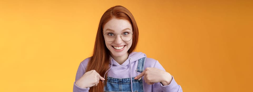 Surprised happy pleased happy smiling young redhead girl getting awesome proposal grinning questioned pointing herself laughing full disbelief receive promotion unbelievable chance. Copy space