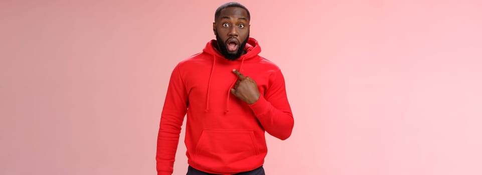 Shocked guy cannot believe he chosen drop jaw widen eyes staring camera speechless pointing himself impressed cannot believe picked do important task, standing stunned pink background.