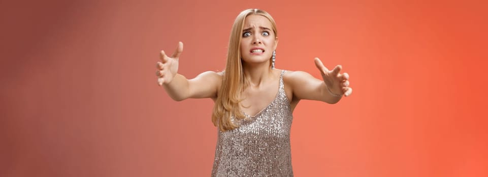 Obsessed ex-girlfriend widen eyes crazy clench teeth stretch hands forward wanna hold tight forever together standing crazy weird red background in silver dress clingy girl want hugs, cuddles.