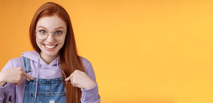 Surprised happy pleased happy smiling young redhead girl getting awesome proposal grinning questioned pointing herself laughing full disbelief receive promotion unbelievable chance. Copy space