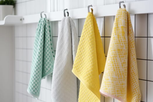 Kitchen colorful towels haning on rack. Cleaning hook. Generate AI