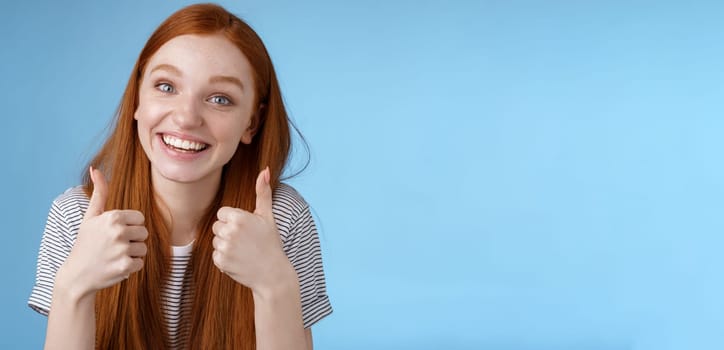 Nice idea keep up. Supportive tender cute european ginger girl blue eyes cheering friend boost mood show thumbs up smiling approval like good choice, agree interesting suggestion, satisfied.