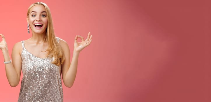 Excited carefree happy stress-free charming blond european woman calm feelings under control show zen gesture standing nirvana lotus pose meditating joyfully smiling, calmd-down red background.