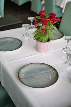 round bowl or ceramic plate on napkin on wooden table
