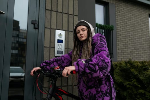 Bicycle rental concept. Young woman riding a sports bike around the city.