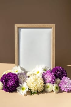 Holiday postcard greeting card photo frame empty paper note around mixed colorful flowers. Copy space mockup template. Minimalistic isometric style Advertisement sample