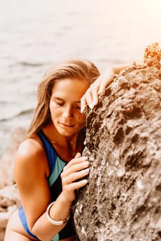 Woman travel summer sea. A happy tourist in a blue bikini enjoying the scenic view of the sea and volcanic mountains while taking pictures to capture the memories of her travel adventure