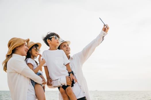 A happy family cherishing moments on the beach capturing laughter and joy while taking a delightful selfie near the sea. A heartwarming portrayal of togetherness during a summer vacation.