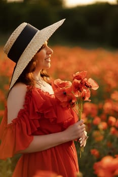 Woman poppy field red dress hat. Happy woman in a long red dress in a beautiful large poppy field. Blond stands with her back posing on a large field of red poppies