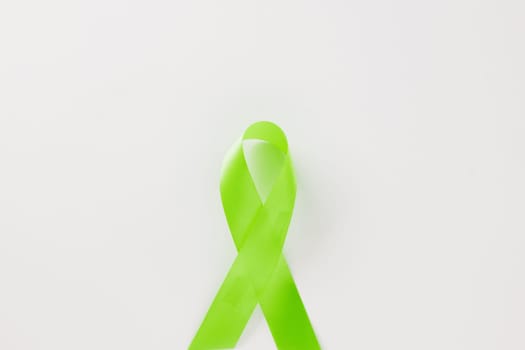 Green awareness ribbon of Gallbladder and Bile Duct Cancer month isolated on white background with copy space, concept of medical and health care support, Cancer awareness, World kidney day