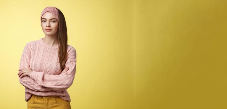 Try me. Confident glamour young female beauty salon manager cross hands over chest looking confident and sassy with self-assured smirk. Girl student posing against yellow background encouraged.