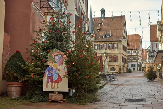 Winter Festivities in Bitigheim-Bissingen: Charming Half-Timbered Houses Adorned with Christmas Decorations. Step into the enchanting New Year's atmosphere of Bitigheim-Bissingen, Baden-Württemberg, Germany, where half-timbered houses line the streets, beautifully decorated with festive Christmas ornaments. The photograph is artfully processed in warm vintage tones, capturing the essence of winter joy in this picturesque town.