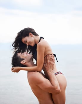 Couple, beach and ocean with love, smile and romance with swimwear and bikini. Man, woman and date with holiday, vacation and adventure with nature for cape town summer travel and happiness for trip.