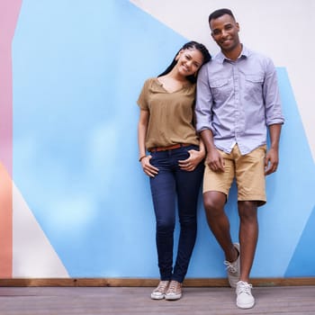 Portrait, smile for fashion and black couple on wall background together with colorful space or mockup. Love, date or affection with happy young man and woman outdoor in city for summer bonding.