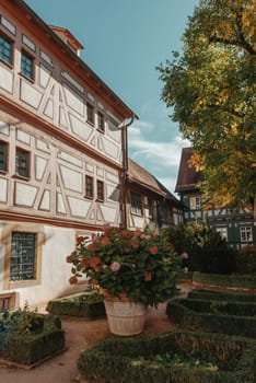 Old national German town house. Old Town is full of colorful and well preserved buildings. Baden-Wurttemberg is a state in southwest Germany bordering France and Switzerland. The Black Forest, known for its evergreen scenery and traditional villages, lies in the mountainous southwest. Stuttgart, the capital, is home to Wilhelma, a royal estate turned zoo and gardens. Porsche and Mercedes-Benz have headquarters and museums there. The 19th-century Hohenzollern Castle sits in the Swabian Alps to the south.